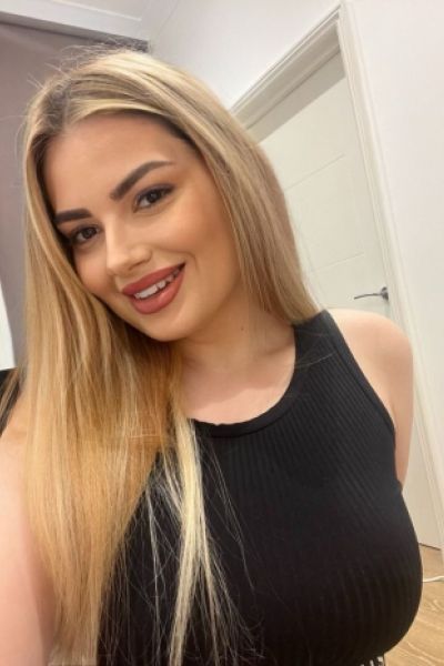 A smiling selfie of a very beautiful blonde escort 